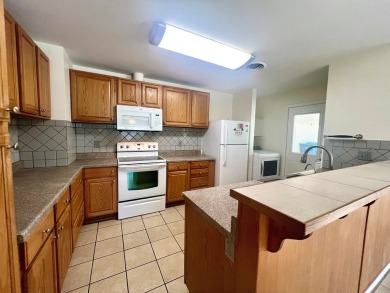 Nicely updated 3/2 brick home perched high for stunning views on Scott Schriener Municipal Golf Course in Texas - for sale on GolfHomes.com, golf home, golf lot