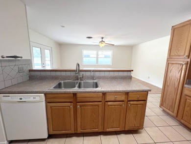 Nicely updated 3/2 brick home perched high for stunning views on Scott Schriener Municipal Golf Course in Texas - for sale on GolfHomes.com, golf home, golf lot