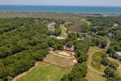 Nestled in the heart of Pawleys Plantation, this private corner on Pawleys Plantation Golf and Country Club in South Carolina - for sale on GolfHomes.com, golf home, golf lot