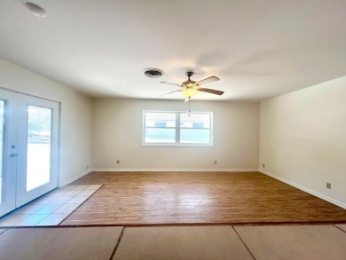 Nicely updated 3/2 brick home perched high for stunning views on Scott Schriener Municipal Golf Course in Texas - for sale on GolfHomes.com, golf home, golf lot