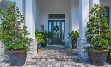 Experience refined living in this 2022 custom-built residence on Indian River Club in Florida - for sale on GolfHomes.com, golf home, golf lot