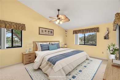 Charming 2BR/2BA condo w/ beautiful lake & golf views, soaring on Pelican Pointe 9 Hole Course in Florida - for sale on GolfHomes.com, golf home, golf lot