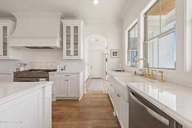 Located in the prestigious gated community of Le Triomphe Golf & on LeTriomphe Golf and Country Club in Louisiana - for sale on GolfHomes.com, golf home, golf lot