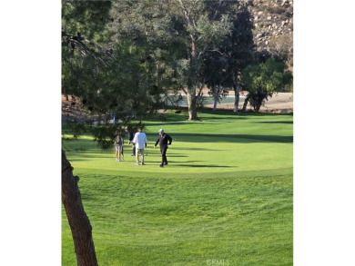 Location, location, location! This adorable turnkey gem is on Canyon Lake Country Club in California - for sale on GolfHomes.com, golf home, golf lot