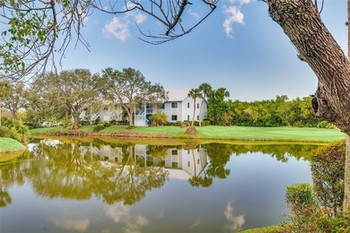 Charming 2BR/2BA condo w/ beautiful lake & golf views, soaring on Pelican Pointe 9 Hole Course in Florida - for sale on GolfHomes.com, golf home, golf lot