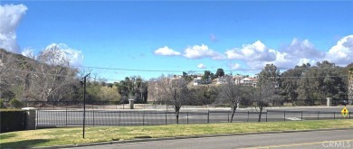 Location, location, location! This adorable turnkey gem is on Canyon Lake Country Club in California - for sale on GolfHomes.com, golf home, golf lot