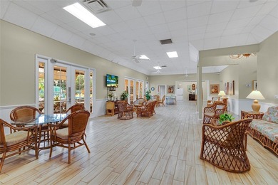 Charming 2BR/2BA condo w/ beautiful lake & golf views, soaring on Pelican Pointe 9 Hole Course in Florida - for sale on GolfHomes.com, golf home, golf lot