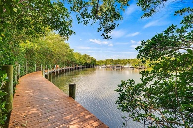 Charming 2BR/2BA condo w/ beautiful lake & golf views, soaring on Pelican Pointe 9 Hole Course in Florida - for sale on GolfHomes.com, golf home, golf lot