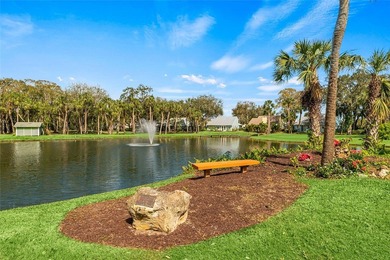 Charming 2BR/2BA condo w/ beautiful lake & golf views, soaring on Pelican Pointe 9 Hole Course in Florida - for sale on GolfHomes.com, golf home, golf lot