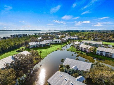 Charming 2BR/2BA condo w/ beautiful lake & golf views, soaring on Pelican Pointe 9 Hole Course in Florida - for sale on GolfHomes.com, golf home, golf lot
