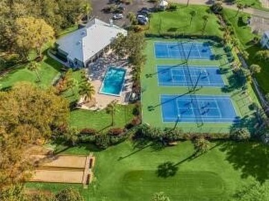 Charming 2BR/2BA condo w/ beautiful lake & golf views, soaring on Pelican Pointe 9 Hole Course in Florida - for sale on GolfHomes.com, golf home, golf lot