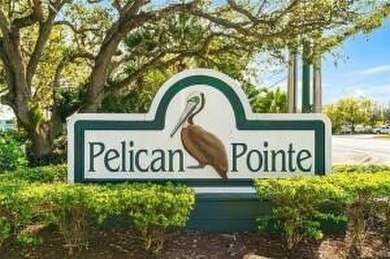Charming 2BR/2BA condo w/ beautiful lake & golf views, soaring on Pelican Pointe 9 Hole Course in Florida - for sale on GolfHomes.com, golf home, golf lot