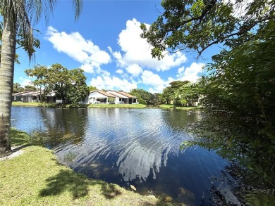 Rarely available, 3 bed/2 bath corner villa on a beautiful on Jacaranda Golf Club in Florida - for sale on GolfHomes.com, golf home, golf lot