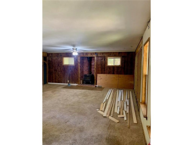 This 2-bedroom, 1-bath home has two lots totalling .75-acre lot on Bella Vista - Metfield Golf Complex and Country Club in Arkansas - for sale on GolfHomes.com, golf home, golf lot