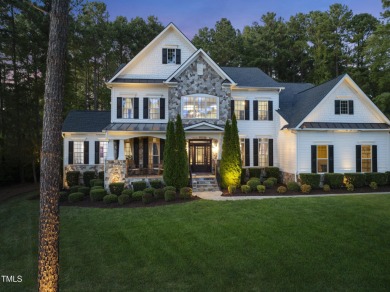 Welcome to an extraordinary home tucked away on a quiet on Hasentree Club in North Carolina - for sale on GolfHomes.com, golf home, golf lot