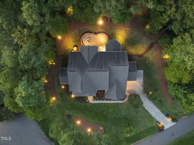 Welcome to an extraordinary home tucked away on a quiet on Hasentree Club in North Carolina - for sale on GolfHomes.com, golf home, golf lot