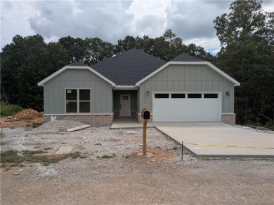 New construction on a large .36 acre wooded lot located near the on Bella Vista - Metfield Golf Complex and Country Club in Arkansas - for sale on GolfHomes.com, golf home, golf lot
