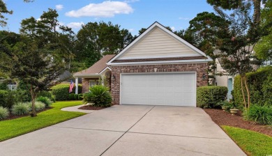 This gorgeous brick residence in sought-after Pawleys Island, SC on Pawleys Plantation Golf and Country Club in South Carolina - for sale on GolfHomes.com, golf home, golf lot