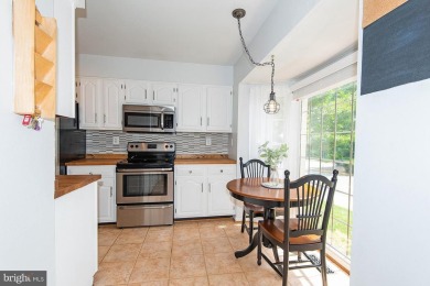 This spacious 3-level townhome is nestled in the sought-after on Bay Hills Golf Club in Maryland - for sale on GolfHomes.com, golf home, golf lot