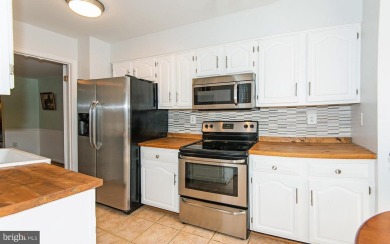 This spacious 3-level townhome is nestled in the sought-after on Bay Hills Golf Club in Maryland - for sale on GolfHomes.com, golf home, golf lot