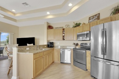 PGA VILLAGE CONDO WITH A SWEEPING VIEW OF THE PGA PETE DYE on The Legacy Golf and Tennis Club in Florida - for sale on GolfHomes.com, golf home, golf lot