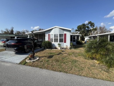 ***JUST REDUCED***This 2/2 1045 sq ft home is beautifully on Lake Henry Golf Club in Florida - for sale on GolfHomes.com, golf home, golf lot