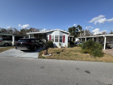 ***JUST REDUCED***This 2/2 1045 sq ft home is beautifully on Lake Henry Golf Club in Florida - for sale on GolfHomes.com, golf home, golf lot