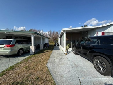 ***JUST REDUCED***This 2/2 1045 sq ft home is beautifully on Lake Henry Golf Club in Florida - for sale on GolfHomes.com, golf home, golf lot