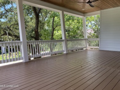 You know that one house that just feels like a coastal getaway on Pass Christian Isles Golf Club in Mississippi - for sale on GolfHomes.com, golf home, golf lot