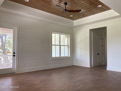 You know that one house that just feels like a coastal getaway on Pass Christian Isles Golf Club in Mississippi - for sale on GolfHomes.com, golf home, golf lot