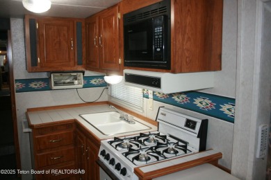 Spacious 1998 nomad park model, 584 square feet. Large living on Star Valley RV Golf Course in Wyoming - for sale on GolfHomes.com, golf home, golf lot
