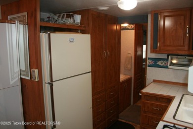 Spacious 1998 nomad park model, 584 square feet. Large living on Star Valley RV Golf Course in Wyoming - for sale on GolfHomes.com, golf home, golf lot