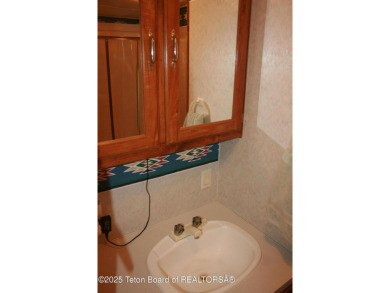 Spacious 1998 nomad park model, 584 square feet. Large living on Star Valley RV Golf Course in Wyoming - for sale on GolfHomes.com, golf home, golf lot