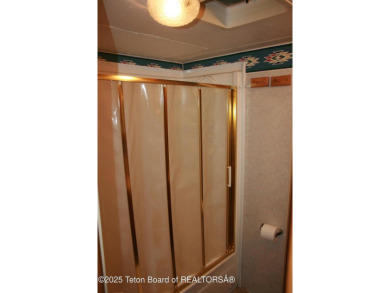 Spacious 1998 nomad park model, 584 square feet. Large living on Star Valley RV Golf Course in Wyoming - for sale on GolfHomes.com, golf home, golf lot
