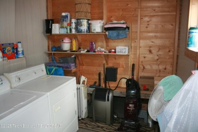 Spacious 1998 nomad park model, 584 square feet. Large living on Star Valley RV Golf Course in Wyoming - for sale on GolfHomes.com, golf home, golf lot