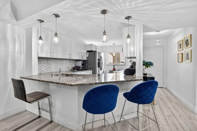 This Updated 55+,1300 SQFT. 2/2 Condo with updated kitchen on Boca Dunes Golf and Country Club in Florida - for sale on GolfHomes.com, golf home, golf lot