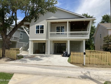 Imagine parking the golf cart after a sun-soaked morning at the on Pass Christian Isles Golf Club in Mississippi - for sale on GolfHomes.com, golf home, golf lot