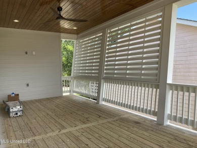 Imagine parking the golf cart after a sun-soaked morning at the on Pass Christian Isles Golf Club in Mississippi - for sale on GolfHomes.com, golf home, golf lot