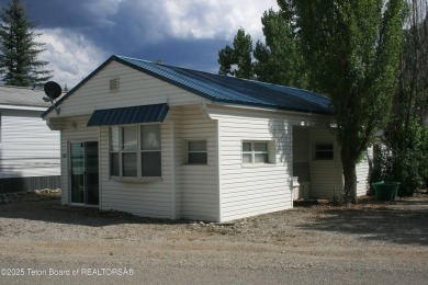 Spacious 1998 nomad park model, 584 square feet. Large living on Star Valley RV Golf Course in Wyoming - for sale on GolfHomes.com, golf home, golf lot