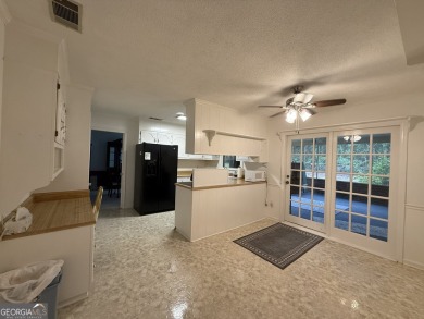 Check out this amazing brick home located near Forest Heights on Forest Heights Country Club in Georgia - for sale on GolfHomes.com, golf home, golf lot