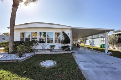 Enjoy relaxed Florida living in this 1978 home nestled inside a on Maple Leaf Golf and Country Club in Florida - for sale on GolfHomes.com, golf home, golf lot