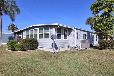 Enjoy relaxed Florida living in this 1978 home nestled inside a on Maple Leaf Golf and Country Club in Florida - for sale on GolfHomes.com, golf home, golf lot