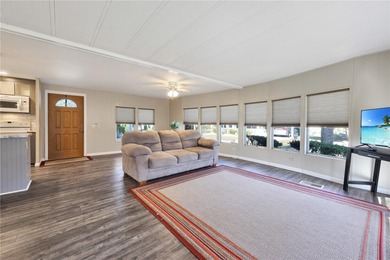 Enjoy relaxed Florida living in this 1978 home nestled inside a on Maple Leaf Golf and Country Club in Florida - for sale on GolfHomes.com, golf home, golf lot