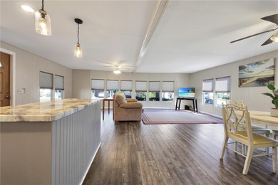 Enjoy relaxed Florida living in this 1978 home nestled inside a on Maple Leaf Golf and Country Club in Florida - for sale on GolfHomes.com, golf home, golf lot