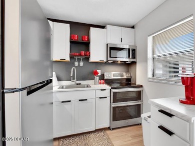 Remodeled 2 bedroom, 2 bath second floor condo offering 910 on Daytona Beach Golf Club in Florida - for sale on GolfHomes.com, golf home, golf lot