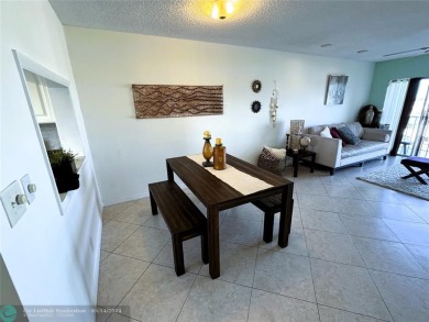 Cozy 2-bedroom, 2-bathroom apartment in a unique location close on Crystal Lake Country Club in Florida - for sale on GolfHomes.com, golf home, golf lot