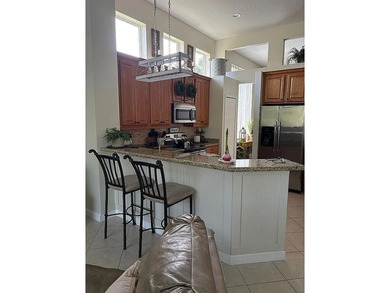 This exceptionally clean home features a newer 2023 heated on The Legacy Golf and Tennis Club in Florida - for sale on GolfHomes.com, golf home, golf lot