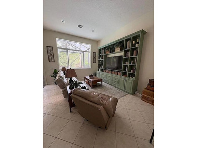 This exceptionally clean home features a newer 2023 heated on The Legacy Golf and Tennis Club in Florida - for sale on GolfHomes.com, golf home, golf lot