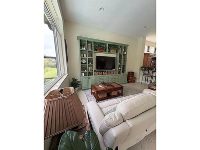 This exceptionally clean home features a newer 2023 heated on The Legacy Golf and Tennis Club in Florida - for sale on GolfHomes.com, golf home, golf lot