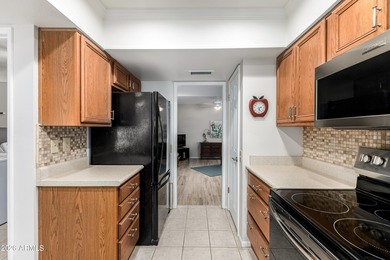 WELCOME to this beautiful, bright & cheery Gemini home situated on Union Hills Country Club in Arizona - for sale on GolfHomes.com, golf home, golf lot